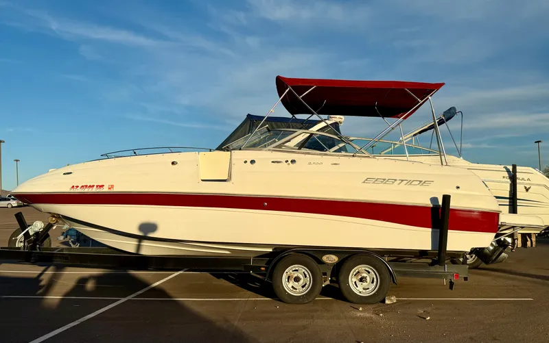 Slide: The Image of 2013 Ebbtide 2500 SS Fun Cruiser DC boat on trailer, red and white design. - 19