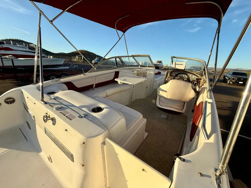 Slide: The Image of 2013 Ebbtide 2500 SS Fun Cruiser DC boat interior with seating and steering wheel. - 5