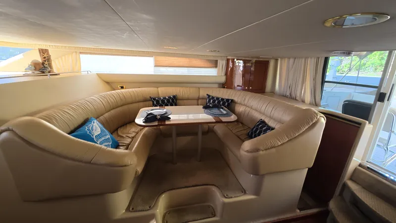 Slide: The Image of Luxurious interior of 2001 Sea Ray 450 Express Bridge with plush seating and elegant decor. - 3