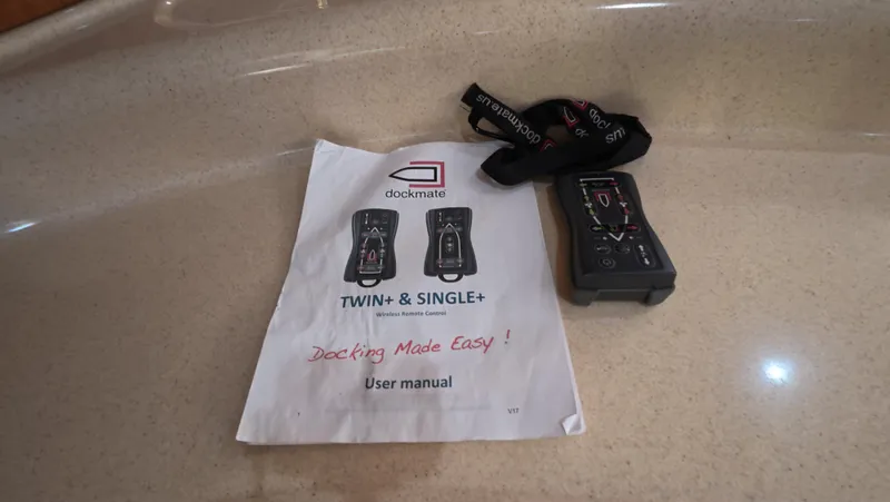 Slide: The Image of Dockmate remote control and user manual on Sea Ray 450 Express Bridge, 2001 model. - 4