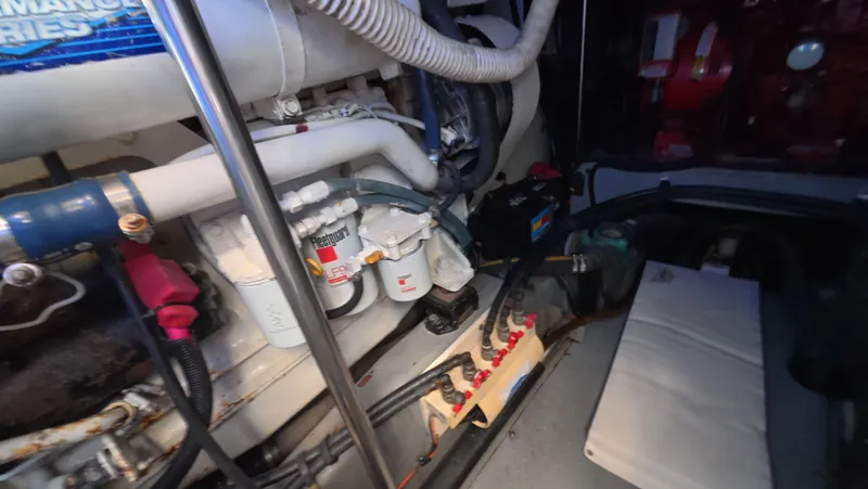 Slide: The Image of Engine room of a 2001 Sea Ray 450 Express Bridge, showcasing mechanical components. - 43