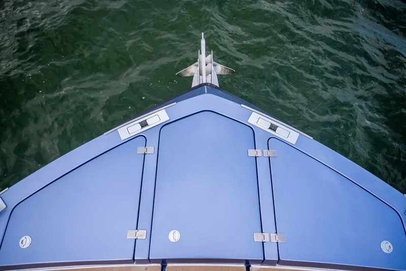 Slide: The Image of Bow of 2026 Santasevera52 yacht with sleek blue design on water. - 15