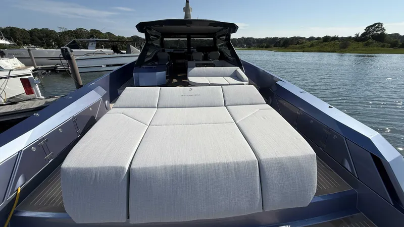 Slide: The Image of Luxurious Santasevera52 yacht with spacious sunbed, docked by serene waters, 2026 model. - 24