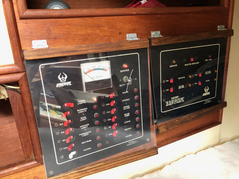 Slide: The Image of Electrical control panels on a 1988 Ericson 30+ sailboat. - 16