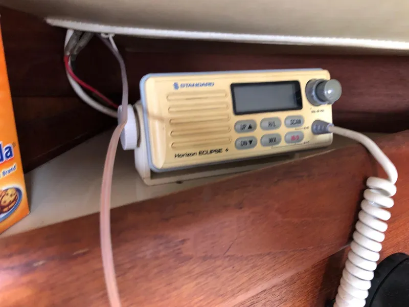 Slide: The Image of VHF radio on 1988 Ericson 30+ sailboat, mounted on wooden panel. - 17