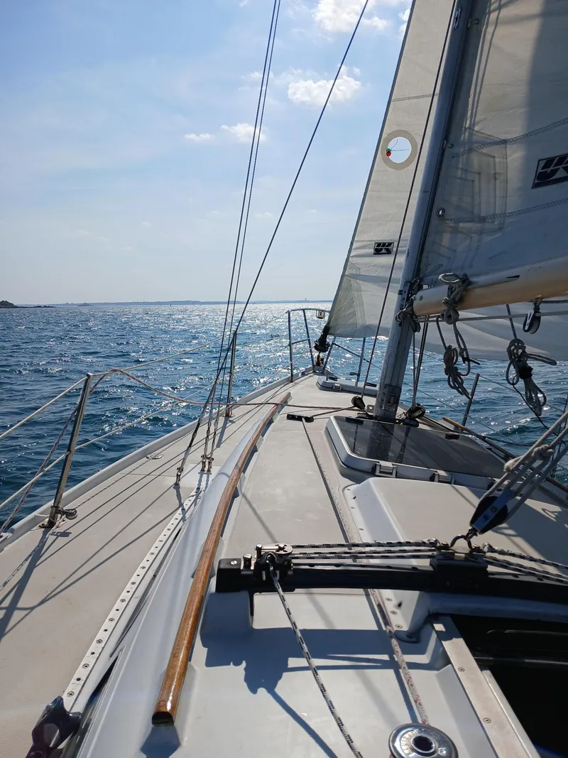 Slide: The Image of Sailing on a 1988 Ericson 30+ yacht under clear blue skies. - 20