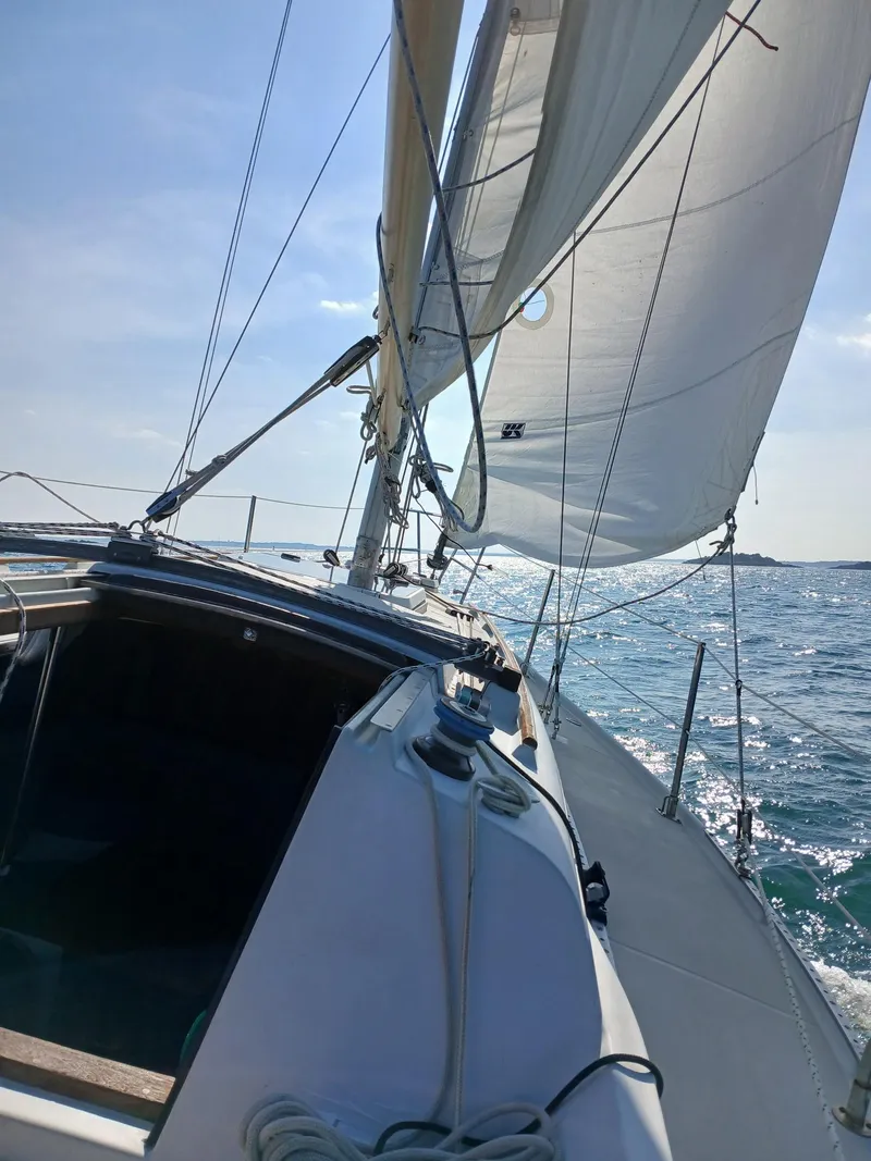 Slide: The Image of Sailing on 1988 Ericson 30+ yacht with full sails on a sunny day. - 21