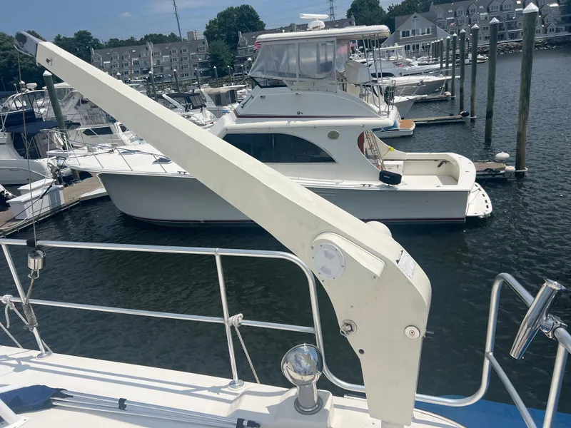 Slide: The Image of Cherubini Independence 1998 yacht docked at marina with other boats in background. - 10