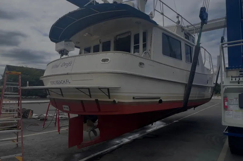 Slide: The Image of Cherubini Independence 1998 boat lifted at Vero Beach, FL marina. - 107