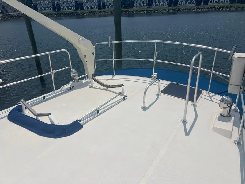 Slide: The Image of Deck of 1998 Cherubini Independence yacht with railing and water view. - 13