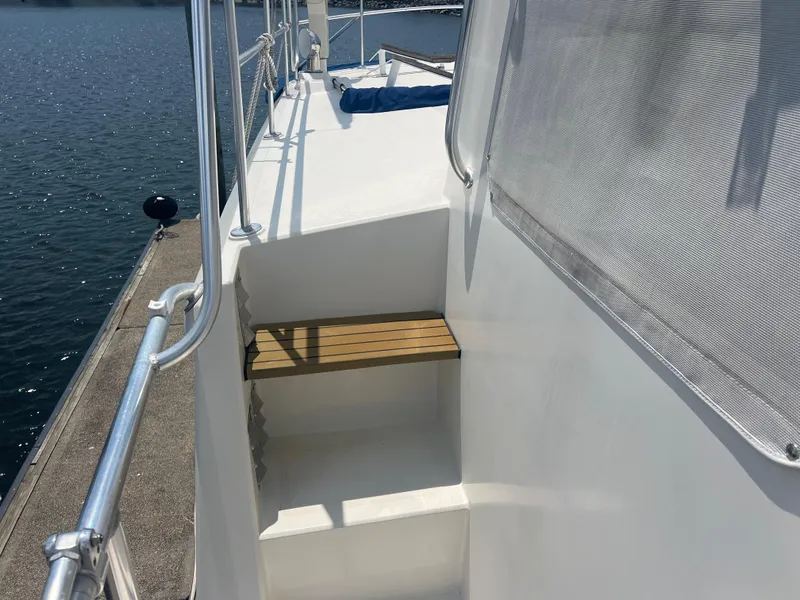 Slide: The Image of Stairs on 1998 Cherubini Independence yacht, docked by the water. - 15