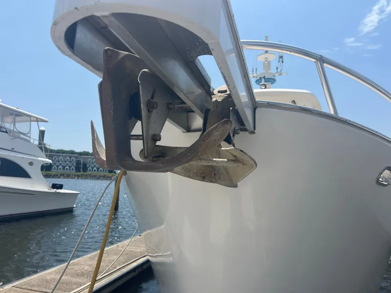 Slide: The Image of Cherubini Independence 1998 boat with anchor, docked in sunny marina. - 19