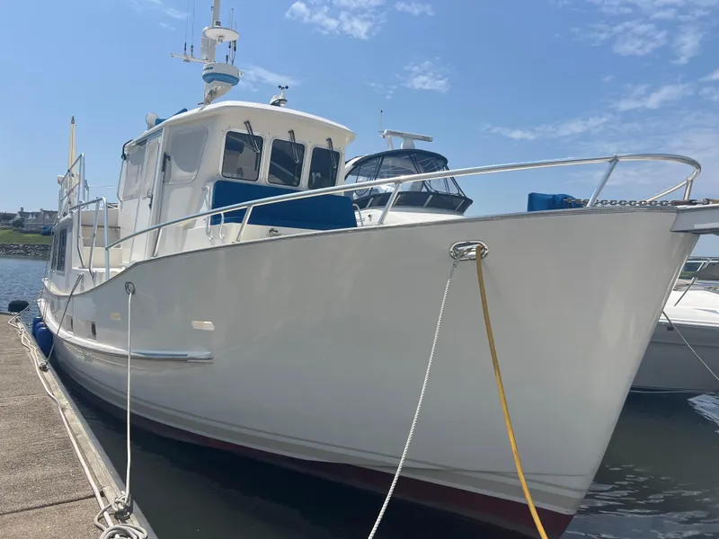 Slide: The Image of Cherubini Independence 1998 yacht docked under clear blue sky. - 21