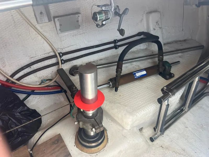 Slide: The Image of Engine compartment of a 1998 Cherubini Independence boat, showing mechanical components and wiring. - 31