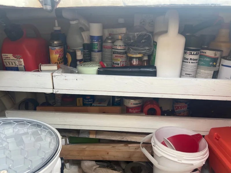 Slide: The Image of Storage shelves with various cleaning supplies and tools on a Cherubini Independence, 1998. - 33