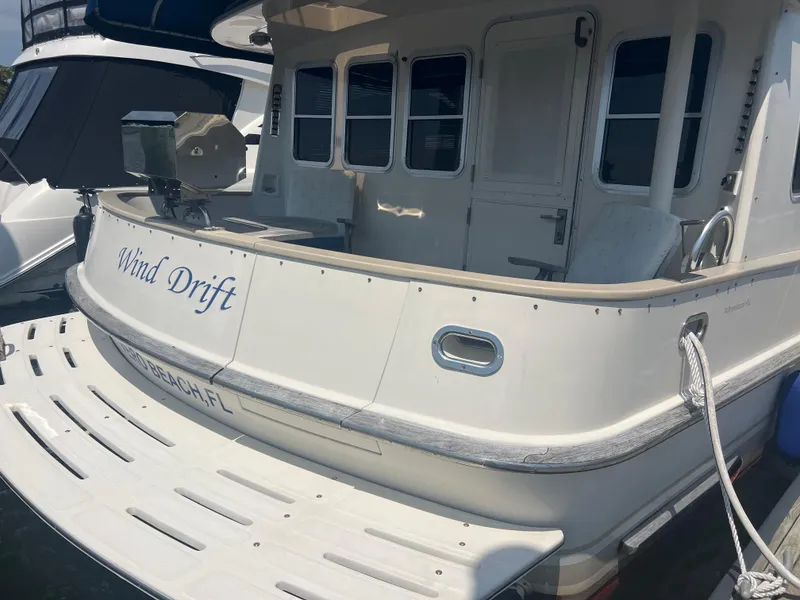 Slide: The Image of 1998 Cherubini Independence yacht named "Wind Drift" docked at a marina. - 36