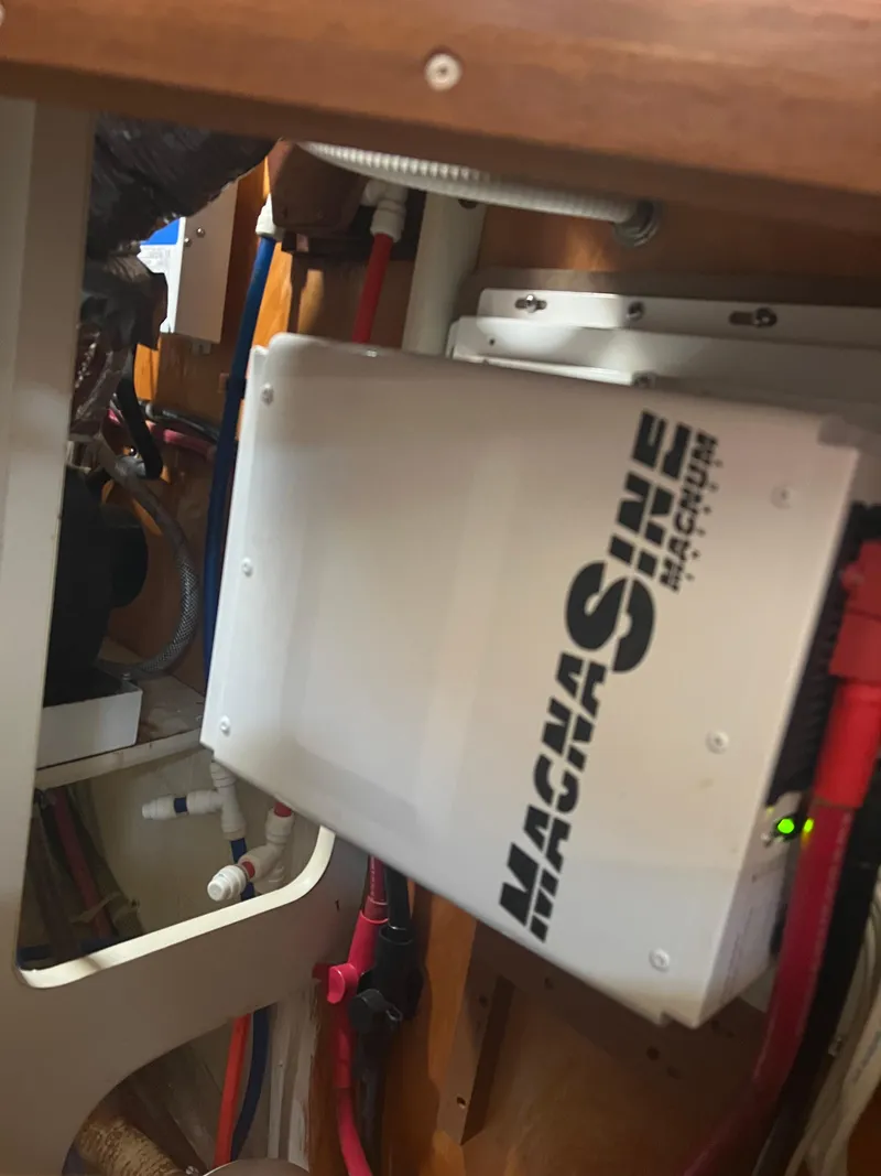 Slide: The Image of Electrical system inside a 1998 Cherubini Independence boat, featuring a Magnum Energy inverter. - 38