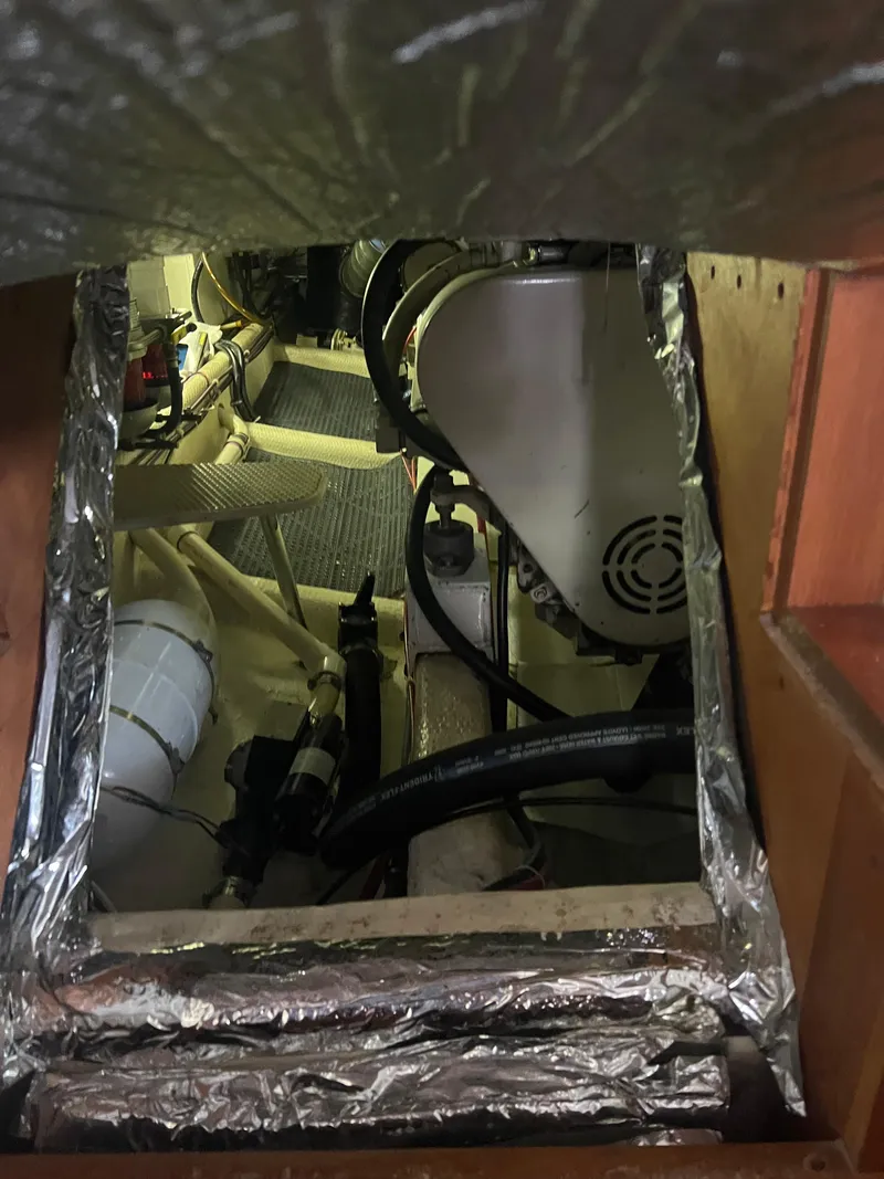 Slide: The Image of Engine room of a 1998 Cherubini Independence boat, showing mechanical components and insulation. - 41