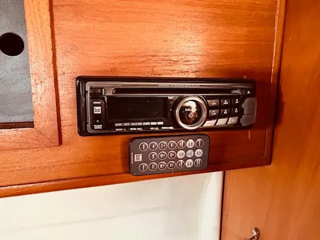 Slide: The Image of Stereo system with remote in a 1986 Pearson 28 boat interior. - 22