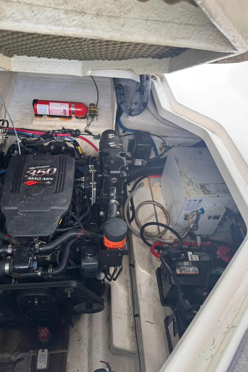 Slide: The Image of Engine compartment of a 2005 Sea Ray 260 Sundancer boat with visible fire extinguisher. - 19