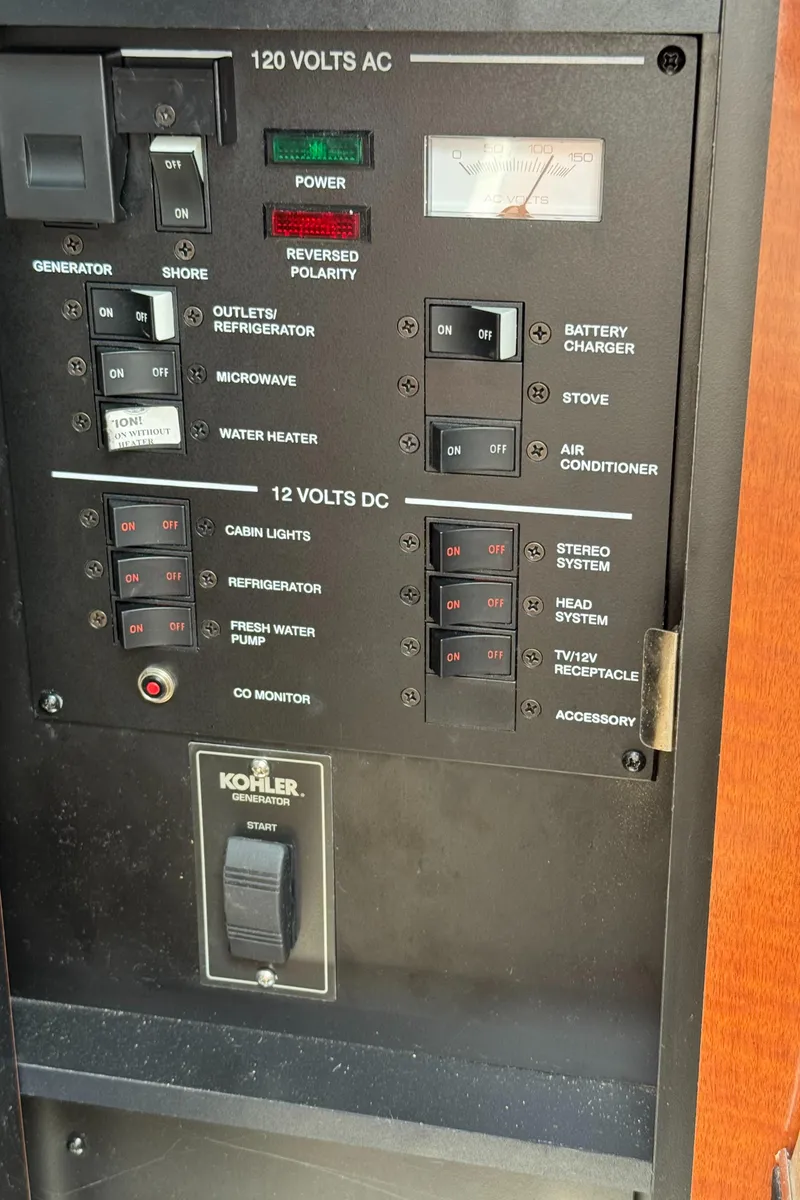 Slide: The Image of Electrical control panel of a 2005 Sea Ray 260 Sundancer boat. - 30