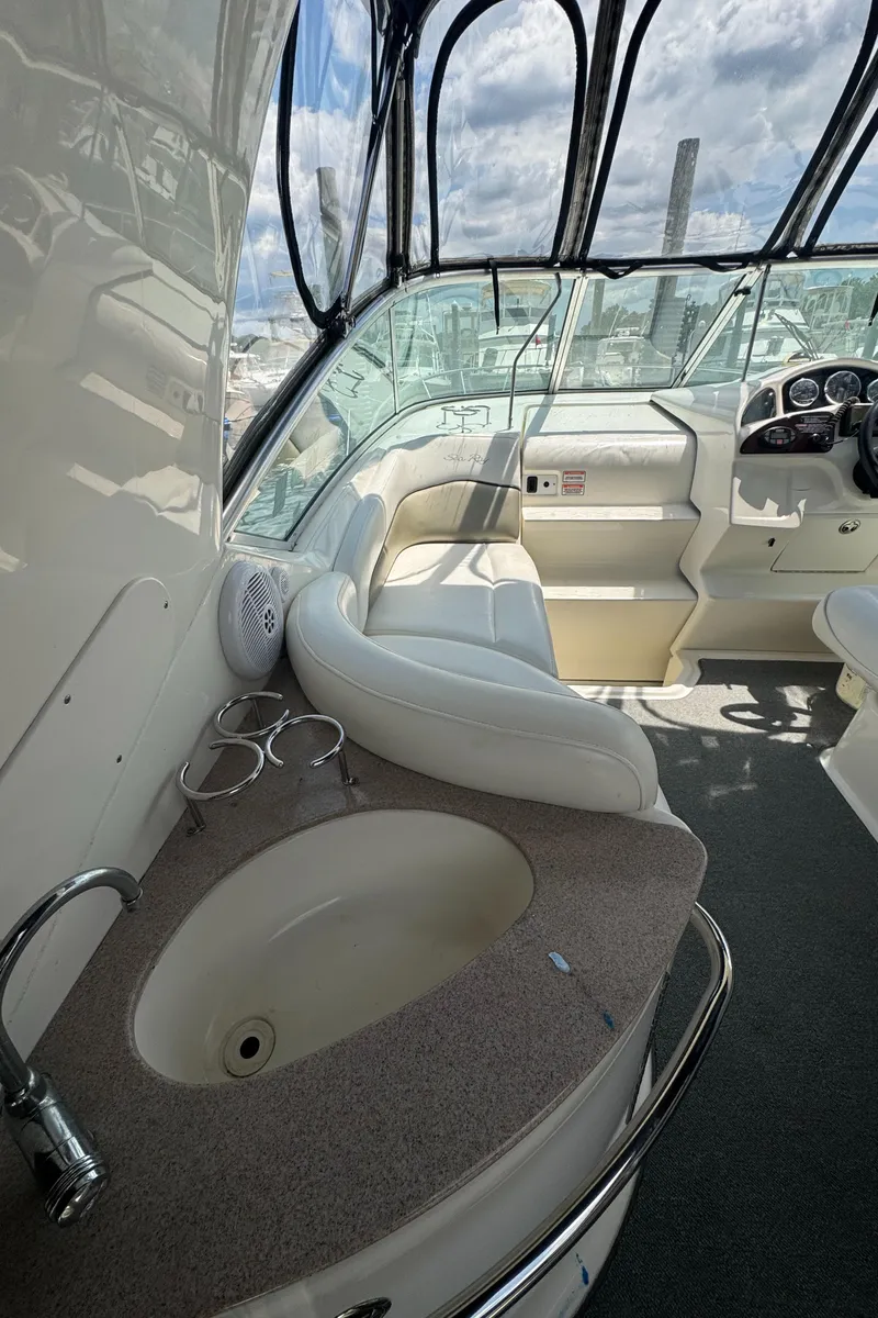 Slide: The Image of Interior of 2005 Sea Ray 260 Sundancer boat with seating and sink. - 7