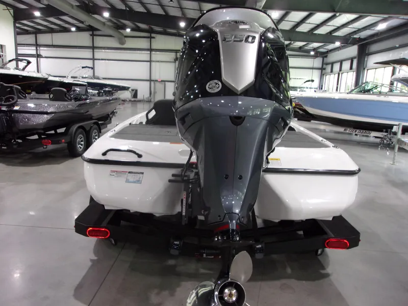 Slide: The Image of 2026 Skeeter ZXR-20 SE boat with powerful outboard motor in showroom. - 11