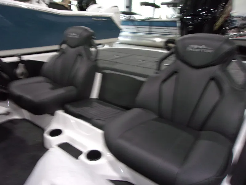 Slide: The Image of 2026 Skeeter ZXR-20 SE boat interior with black seats and cup holders. - 12