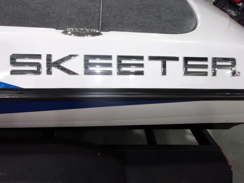 Slide: The Image of Close-up of 2026 Skeeter ZXR-20 SE boat logo on white surface. - 16