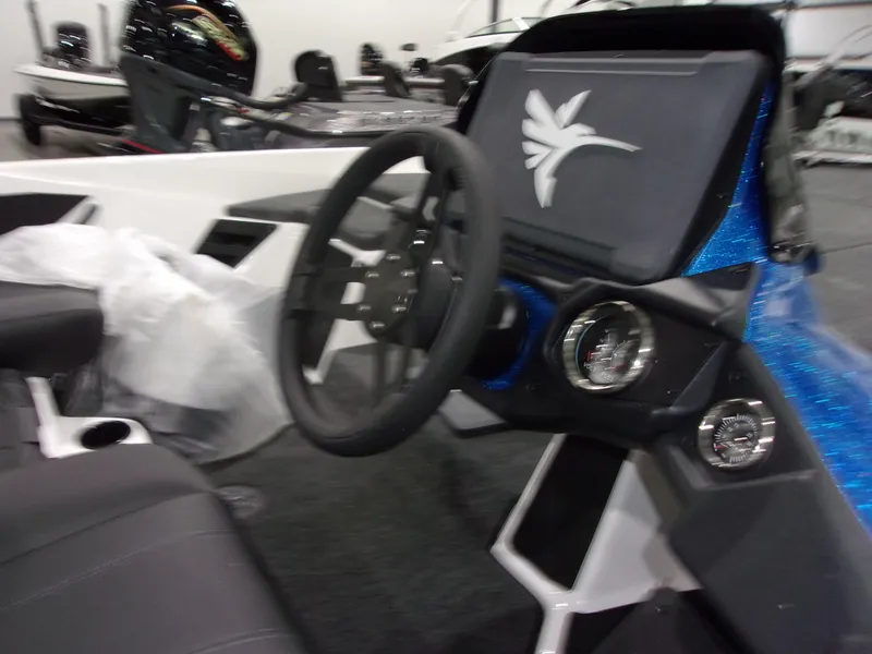 Slide: The Image of 2026 Skeeter ZXR-20 SE boat dashboard with steering wheel and gauges. - 6