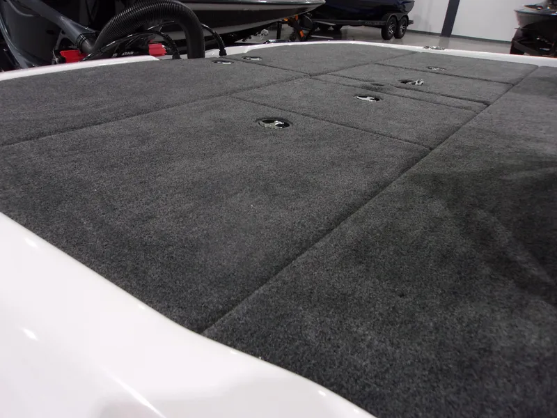 Slide: The Image of 2026 Skeeter ZXR-20 SE boat deck with gray carpeted surface. - 7
