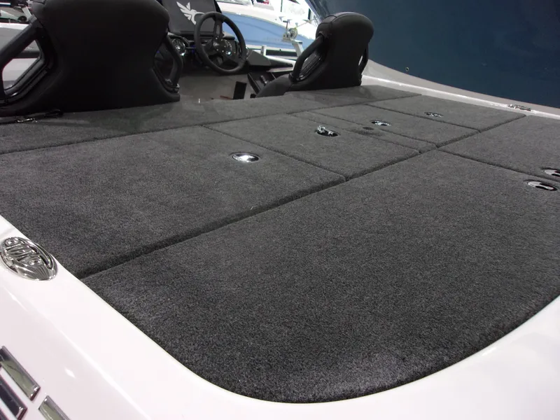 Slide: The Image of 2026 Skeeter ZXR-20 SE boat interior with carpeted deck and seating. - 9