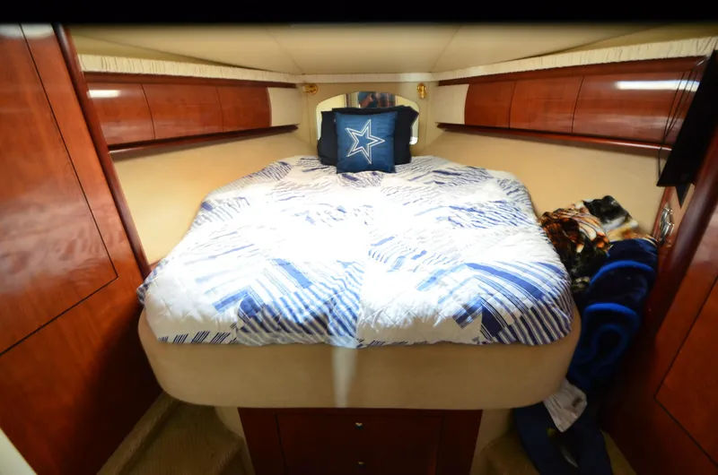 Slide: The Image of Luxurious cabin interior of 2003 Sea Ray 420 Sundancer with cozy bedding. - 15