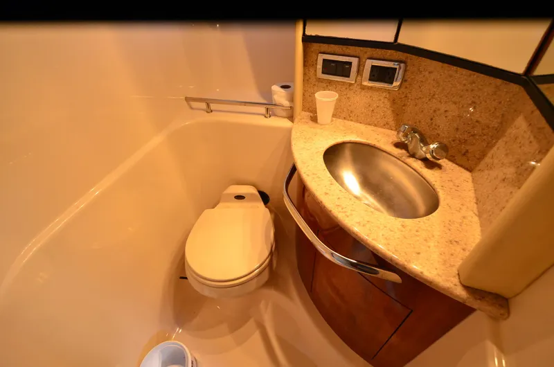 Slide: The Image of Luxurious bathroom in 2003 Sea Ray 420 Sundancer yacht with sink and toilet. - 18