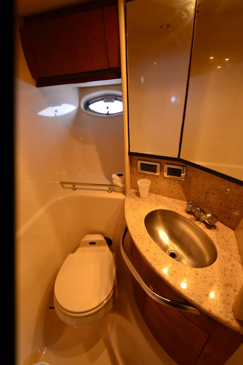 Slide: The Image of Bathroom interior of 2003 Sea Ray 420 Sundancer yacht with sink and toilet. - 19