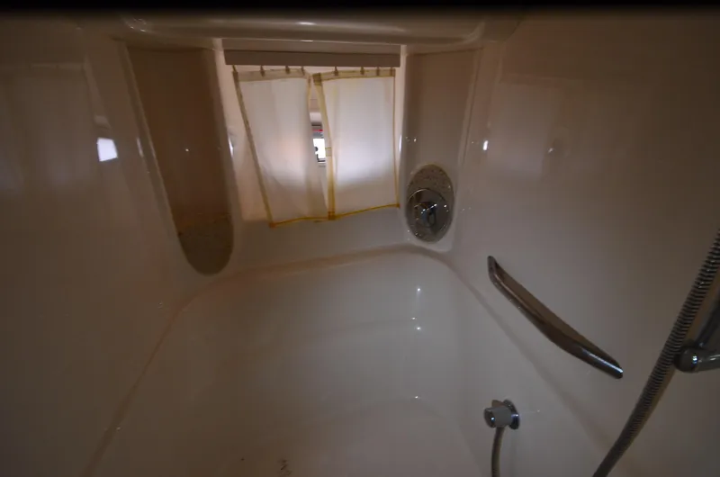 Slide: The Image of Interior of 2003 Sea Ray 420 Sundancer yacht bathroom with shower and curtain. - 20