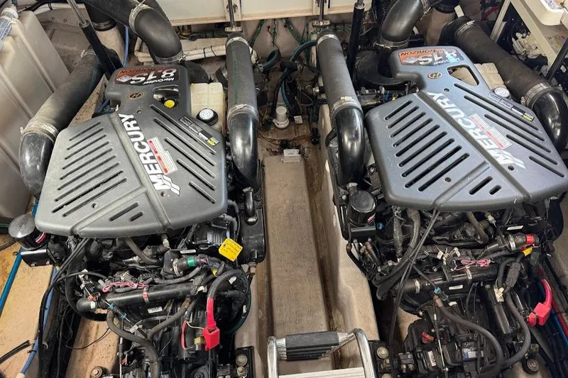 Slide: The Image of Twin Mercury engines in a 2003 Sea Ray 420 Sundancer boat. - 27