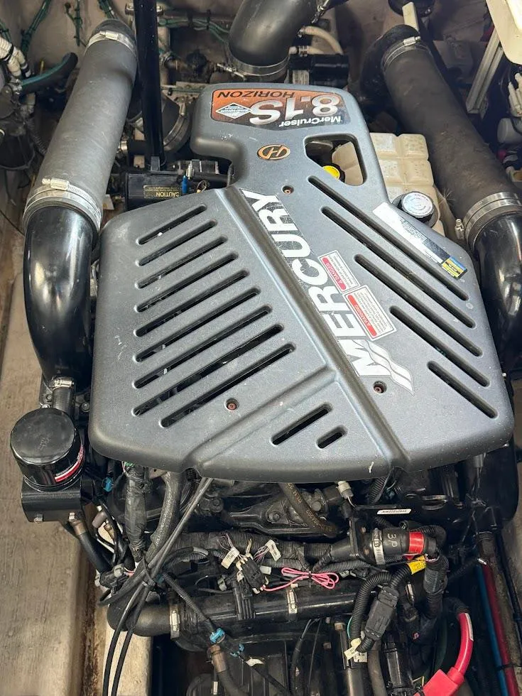 Slide: The Image of Engine of a 2003 Sea Ray 420 Sundancer, featuring a Mercury 8.1S Horizon motor. - 28