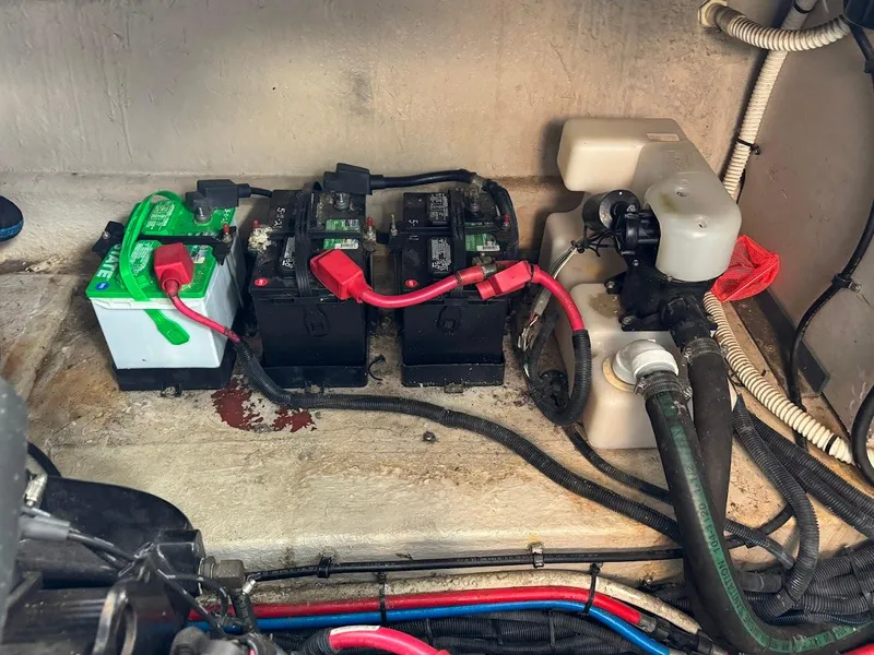 Slide: The Image of Battery compartment of a 2003 Sea Ray 420 Sundancer boat with wiring and components. - 29
