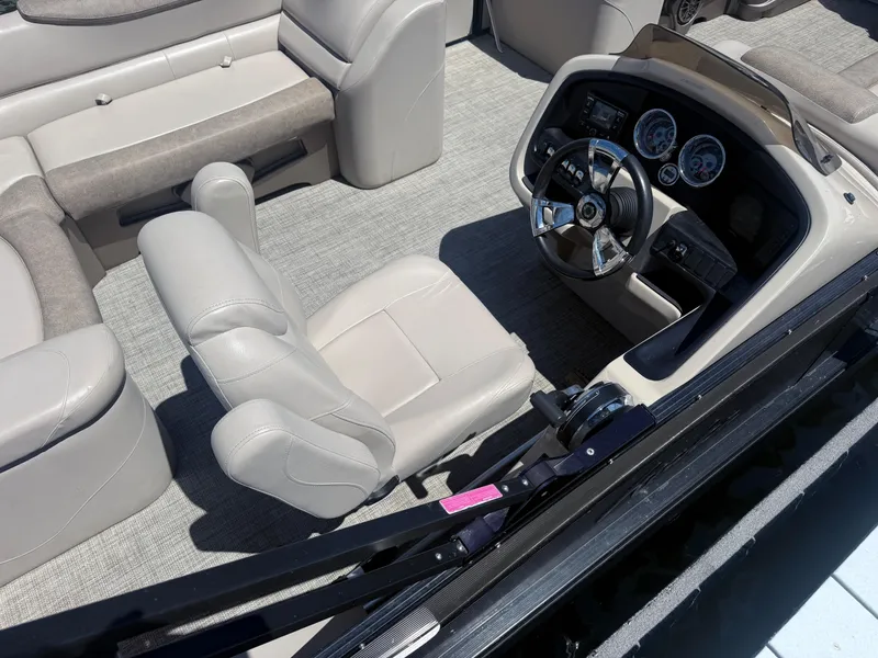 Slide: The Image of Interior of 2020 Avalon 2386 CR boat with steering wheel and seating. - 4