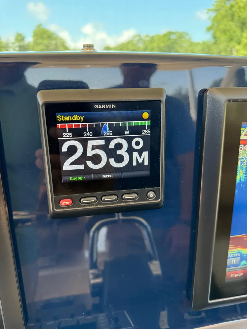 Slide: The Image of Garmin display on 2014 Pursuit ST 310 Sport showing 253° heading in standby mode. - 32