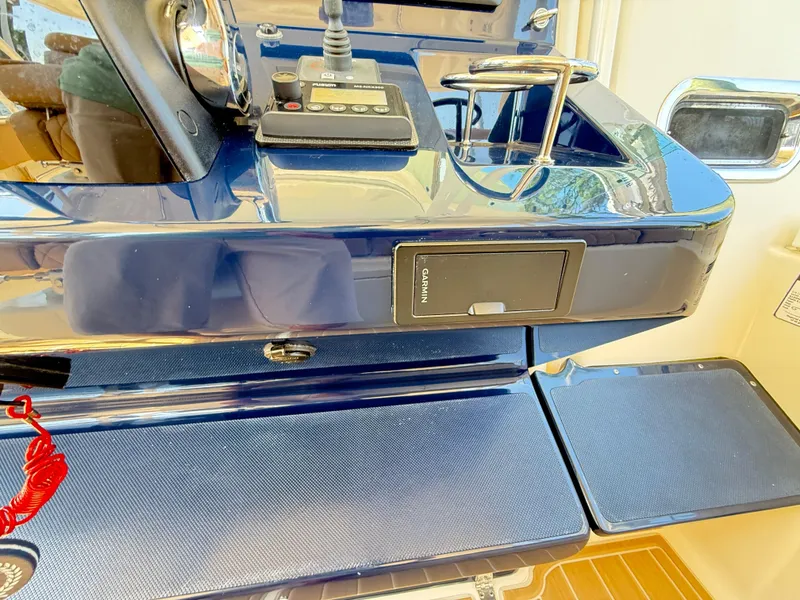 Slide: The Image of Control panel of a 2014 Pursuit ST 310 Sport boat with Garmin equipment. - 34