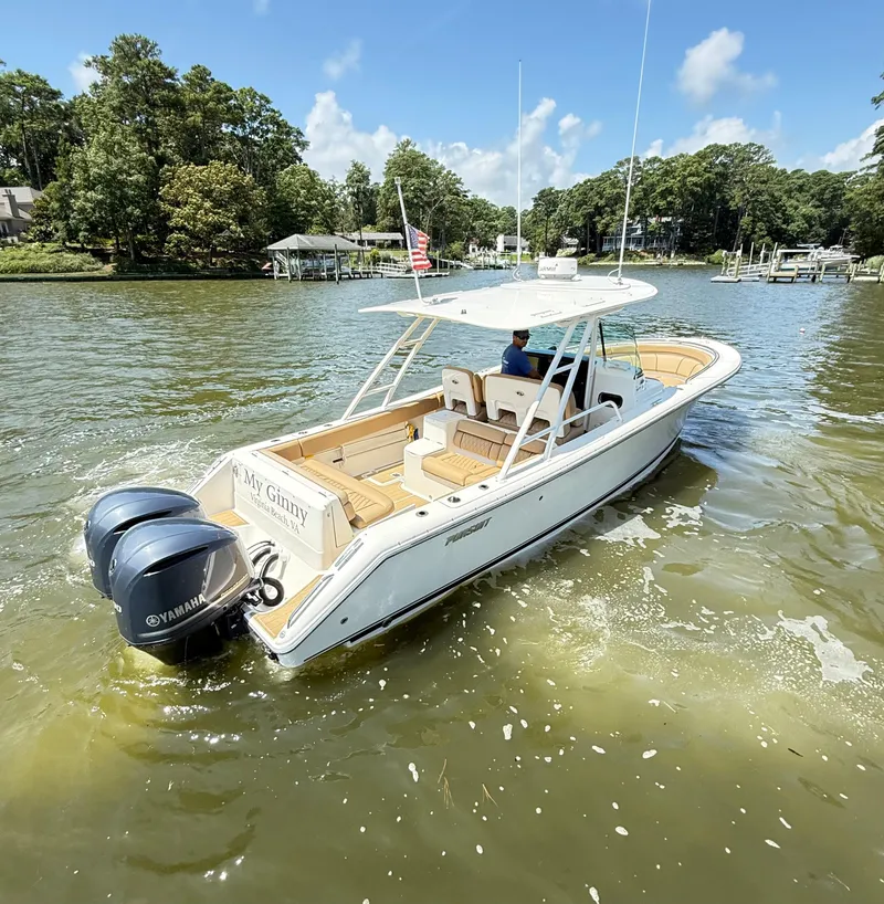 Slide: The Image of 2014 Pursuit ST 310 Sport boat cruising on a sunny lake. - 4