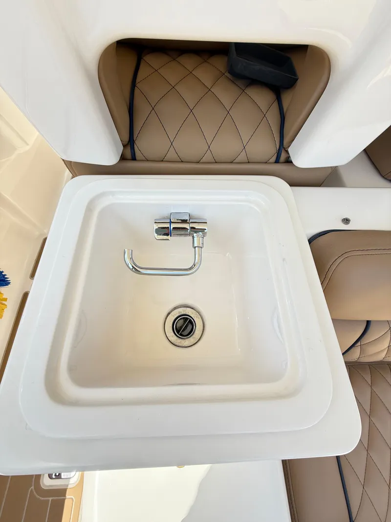 Slide: The Image of 2014 Pursuit ST 310 Sport boat sink with quilted leather seating. - 40