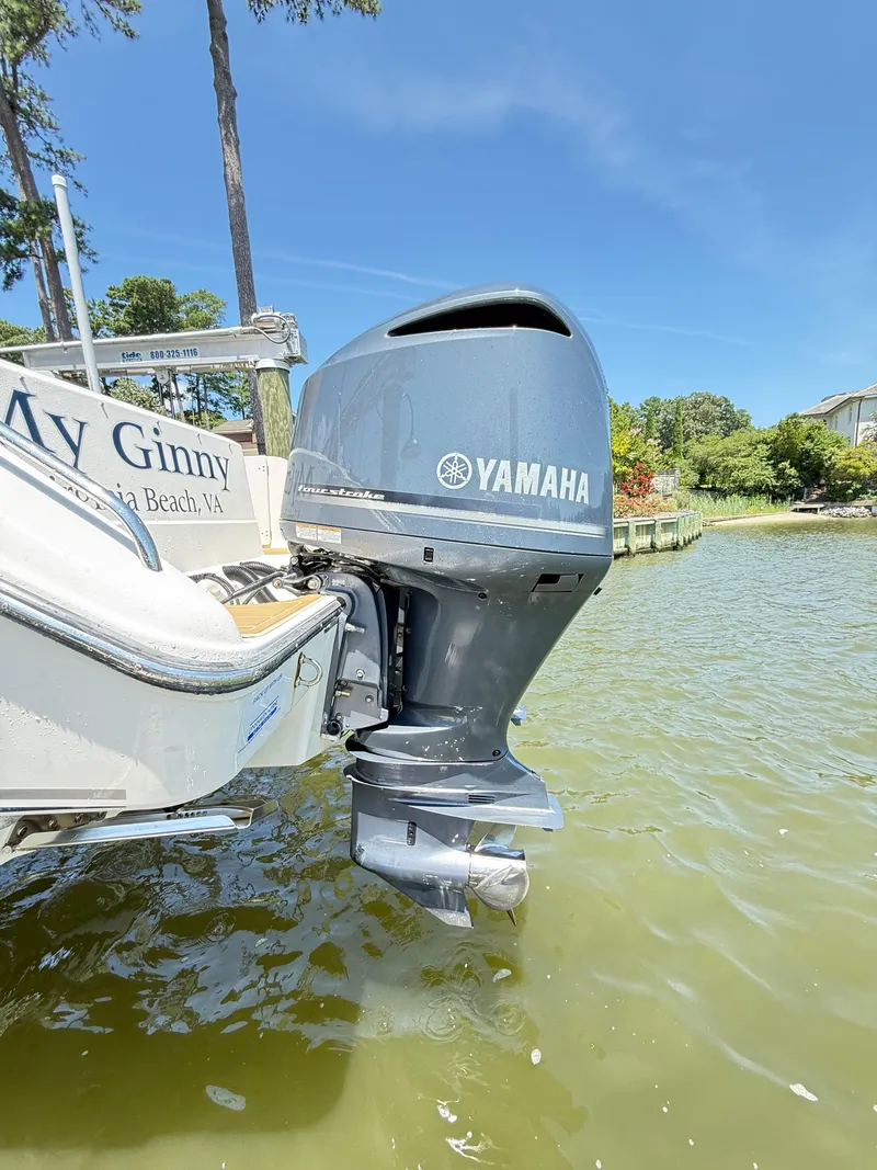 Slide: The Image of 2014 Pursuit ST 310 Sport with Yamaha outboard motor on a sunny day. - 46