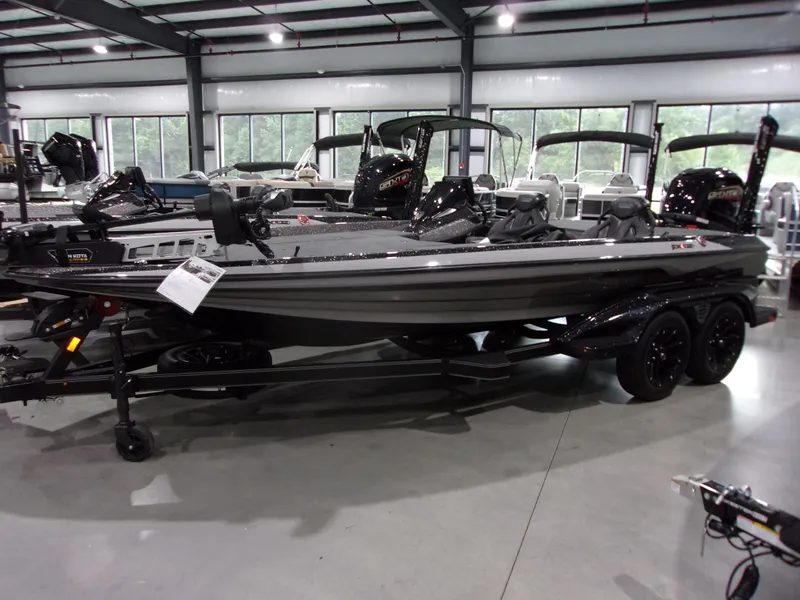 Slide: The Image of 2025 Skeeter FXR-20 Limited Edition boat displayed indoors on a trailer. - 3
