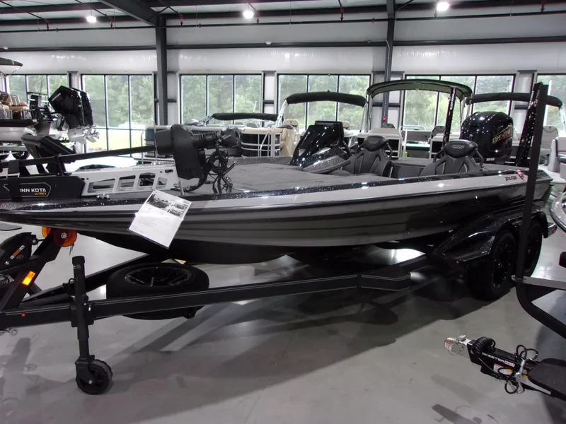 Slide: The Image of 2025 Skeeter FXR-20 Limited Edition boat displayed indoors on a trailer. - 4