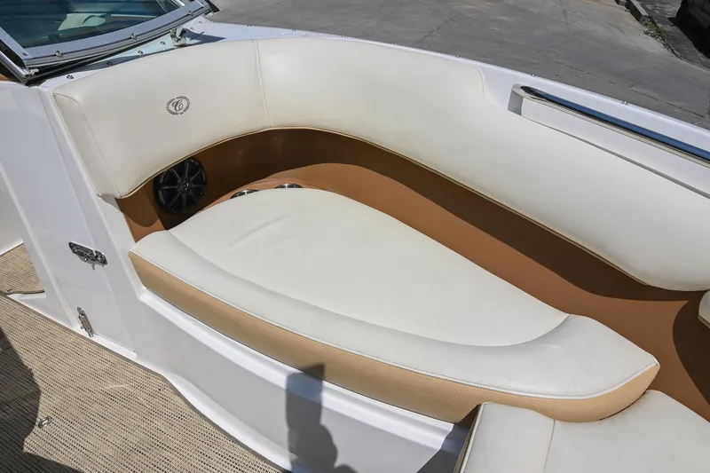 Slide: The Image of 2015 Cobalt 220 boat interior with white and tan seating. - 34