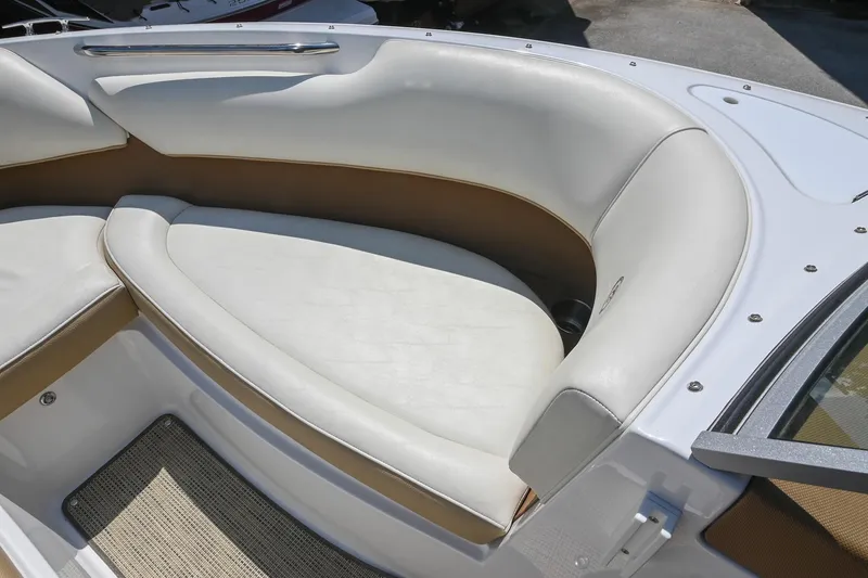 Slide: The Image of 2015 Cobalt 220 boat interior with white and tan seating. - 35
