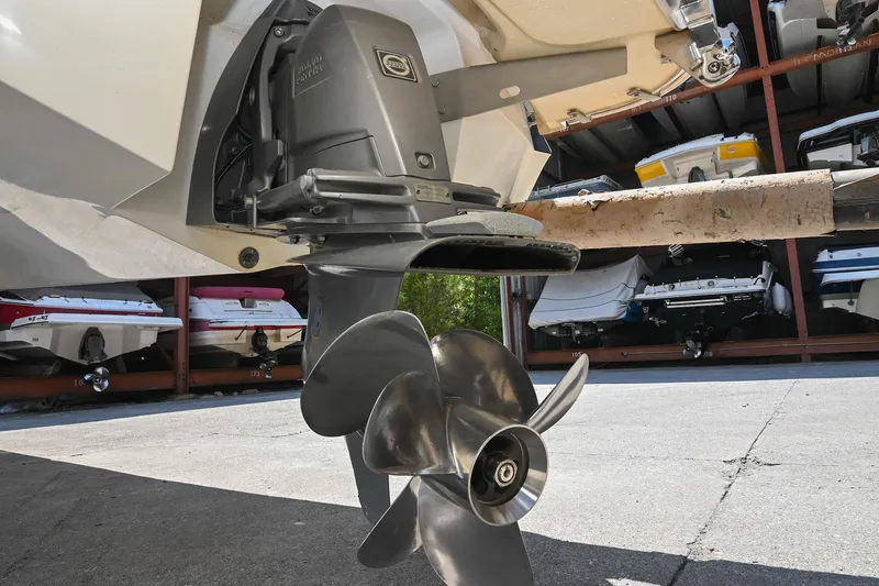 Slide: The Image of Close-up of a 2015 Cobalt 220 boat propeller in a storage facility. - 40